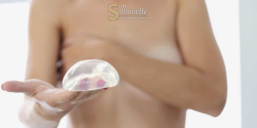 breast implants above or below muscle